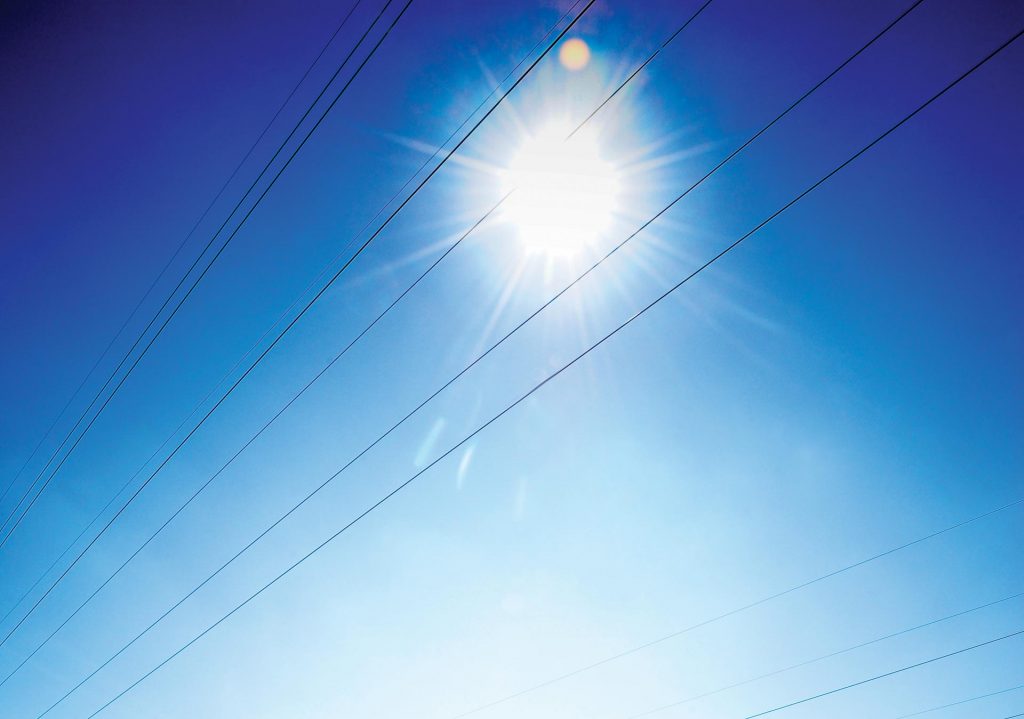 interconnected with a bright blue sky and sun