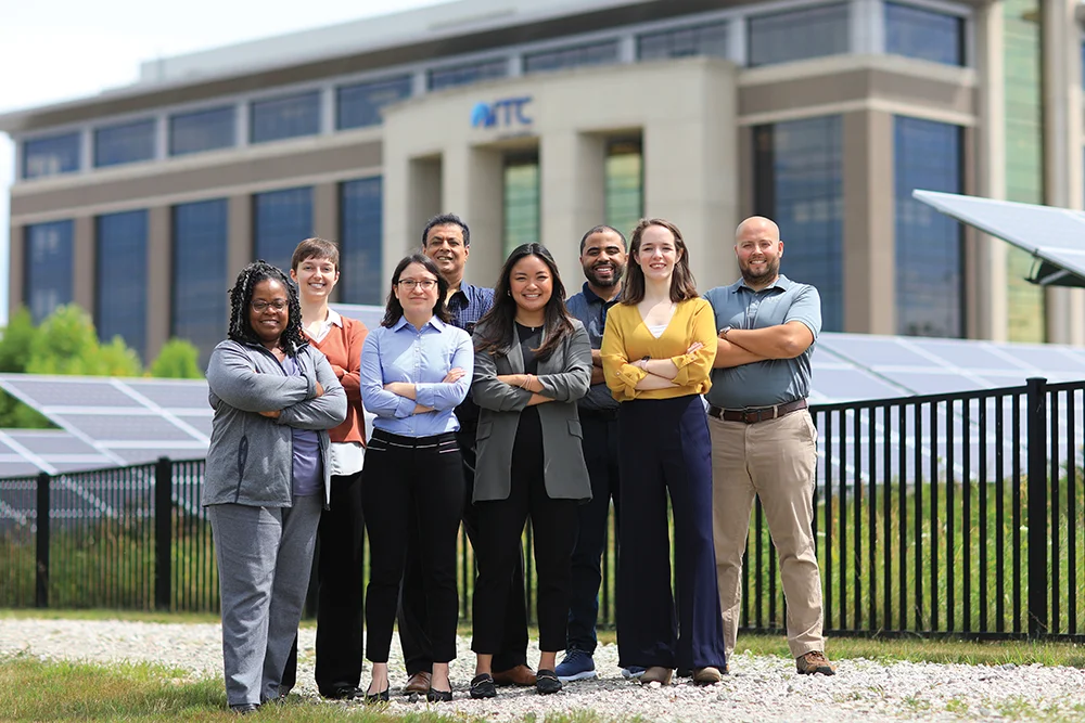 Group of individuals standing posed outside of ITC Holdings Corp. headquarters.