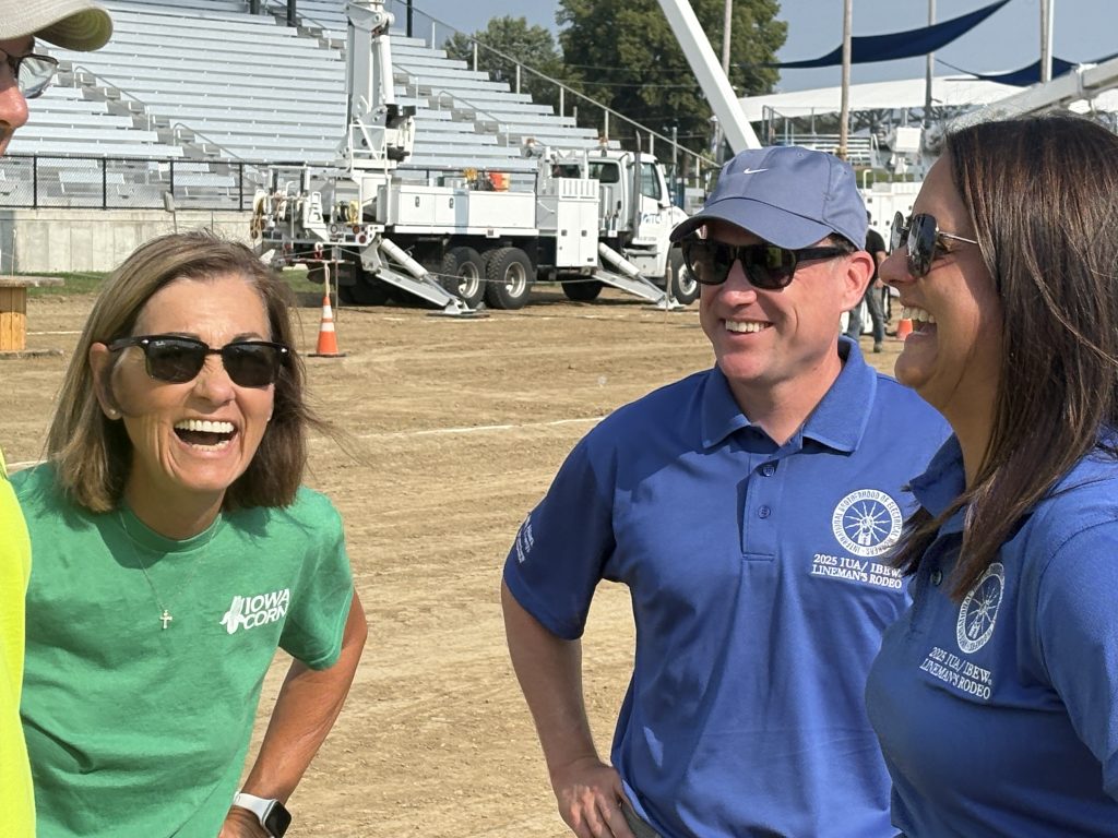 Governor Kim Reynolds chats with ITC Midwest’s Manager of State Government Affairs Brian Selinger and President of Alliant Energy’s Iowa energy company Mayuri Farlinger.