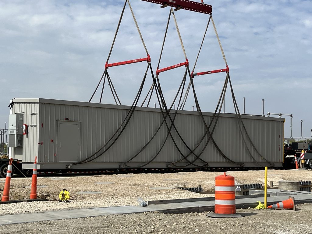 Control enclosures arrive at the Big Cedar Substation.