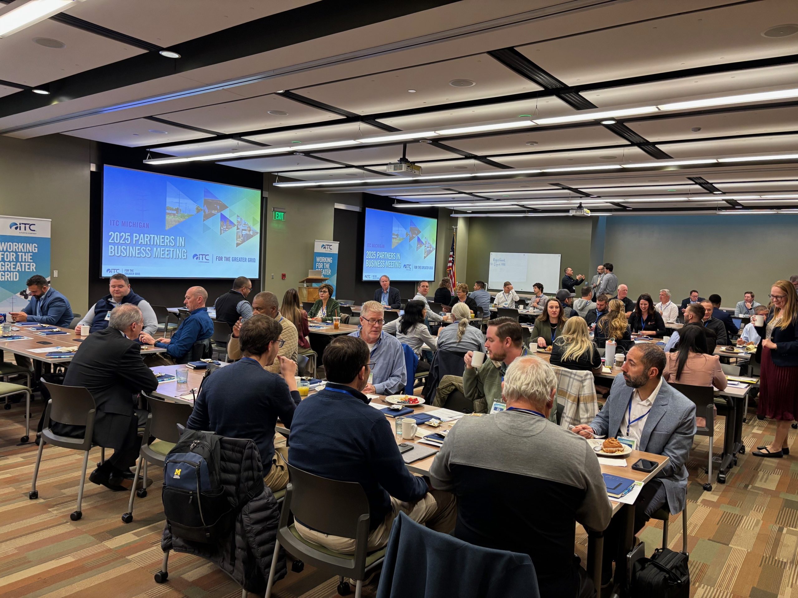 Group of utility stakeholders in conference room for Michigan Partners in Business meeting.